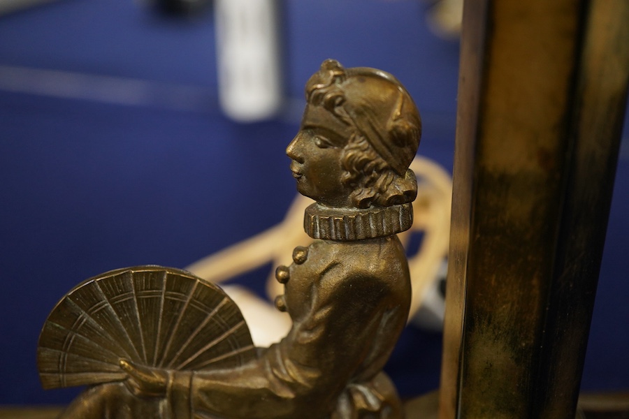An Art Deco bronze table lamp, modelled with a seated woman holding a fan, 28cm high including shade